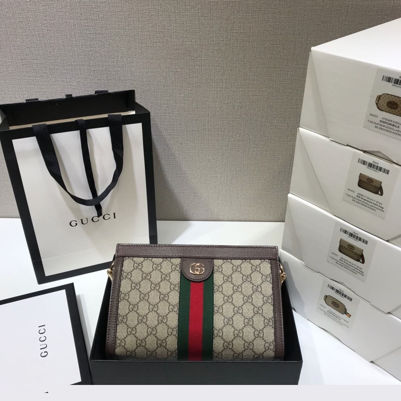 G*u*i clutch bags